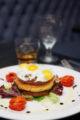 Gourmet burger with potato patty and omelette