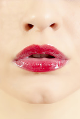 Obraz premium Closeup of sensuous woman wearing red lipstick