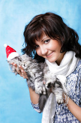 Charming young woman with kitten
