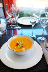 Pumpkin soup on restaurant table