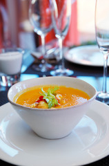 Pumpkin soup on restaurant table