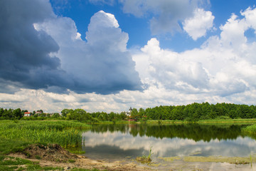 Fototapeta na wymiar lake in village landscape