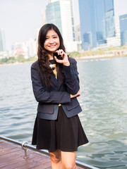 Fototapeta premium Portrait of a woman using a cell phone