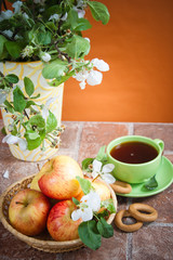 Cup of tea with an apple