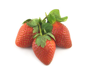 Three ripe appetizing red strawberries isolated closeup