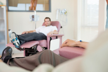 Man With IV Drip Attached To His Hand