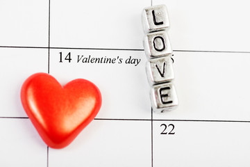 Calendar page with the red hearts on February 14 of  Valentines