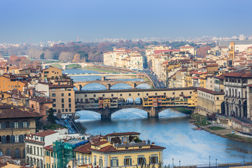 Fototapeta na wymiar Houses, Arno River and bridges of Florence, Tuscany, Italy