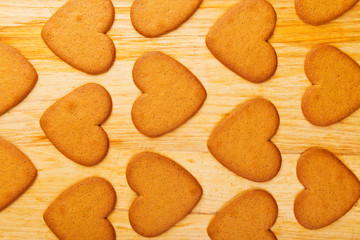 Heart shaped cookies on wooden table background