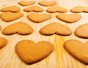 Heart shaped cookies on wooden table background