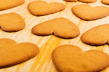 Heart shaped cookies on wooden table background