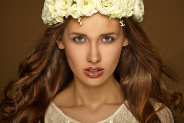 Beautiful portrait of girl with wreath. Makeup.