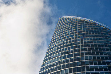 Modern business glass building on blue sky background