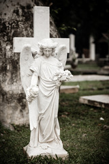 Statue of angel in old cemetery Museum Prasasti