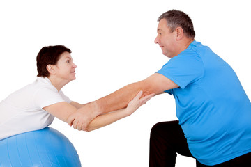 Man and woman with exercise ball