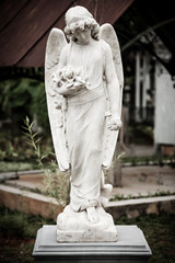 Statue of angel in old cemetery Museum Prasasti