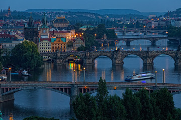 Fototapeta na wymiar View of Prague at night: river Vltava and bridges