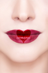 Fototapeta premium Red lips with heart shape