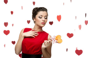 brunette woman holding lollipop