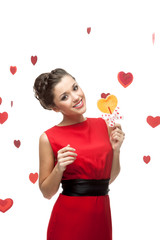 brunette woman holding lollipop