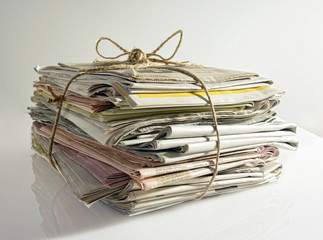 Stack of old newspapers tied with string