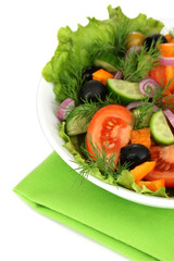Fresh salad in plate isolated on white