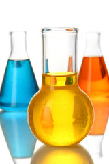 Test tubes with colorful liquids isolated on white