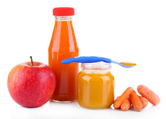 Baby food with carrot and apple in glass jars, isolated on