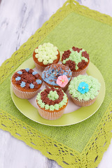 Tasty cupcakes with butter cream,