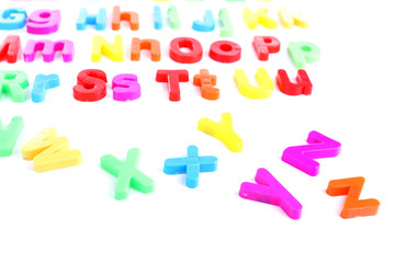 Colorful magnetic letters isolated on white
