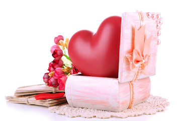 Still life with heart in wooden casket, isolated