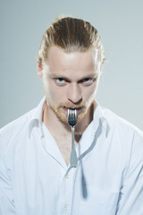 humorous man with fork
