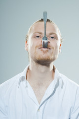 humorous man with fork