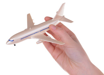 Toy airplane in hand isolated on white