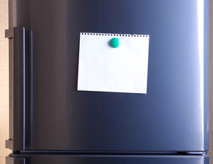 Empty paper sheet on fridge door