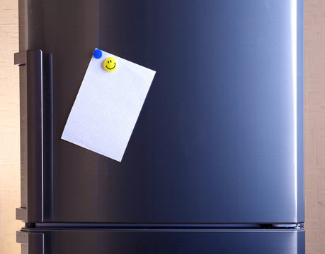 Empty paper sheet on fridge door