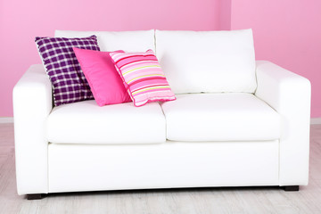 White sofa in room on pink background