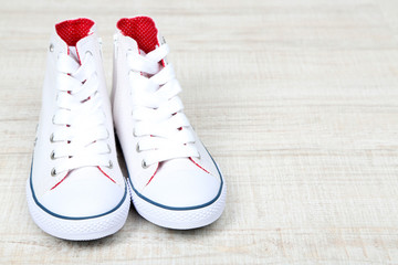 Beautiful gumshoes, on wooden floor