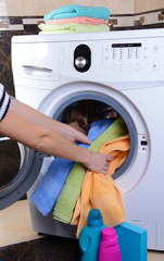 Washing machine loaded with clothes close-up