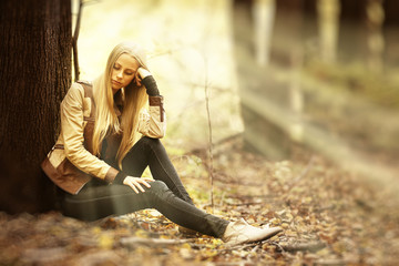 beautiful young girl in the autumn forest