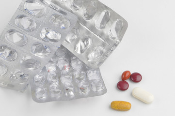 assortment of pills and capsules in blister