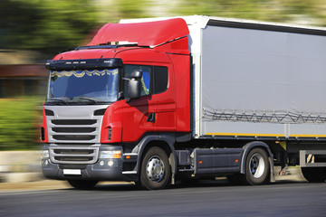 Fototapeta na wymiar truck transports freight