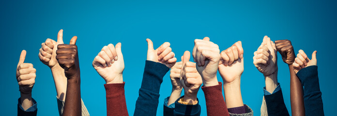 Multiracial Thumbs Up Against Blue Sky - obrazy, fototapety, plakaty