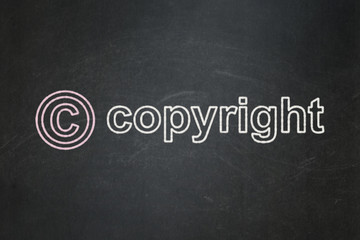Law concept: Copyright and Copyright on chalkboard background