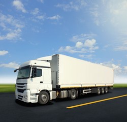 Fototapeta na wymiar White cargo truck on the road