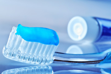 toothbrush and toothpaste tube on the table