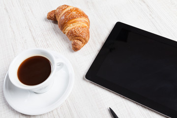 breakfast with  tablet pc on desk