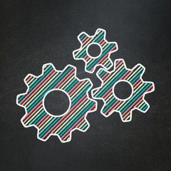 Information concept: Gears on chalkboard background