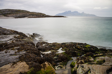 Fototapeta na wymiar Long exposure shot of rocks and waves in Northern Norway
