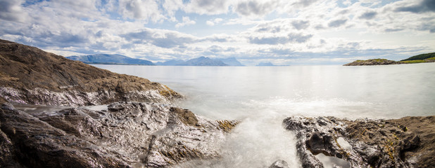 Panoramic long exposure shot of the sea with rocks in Northern N